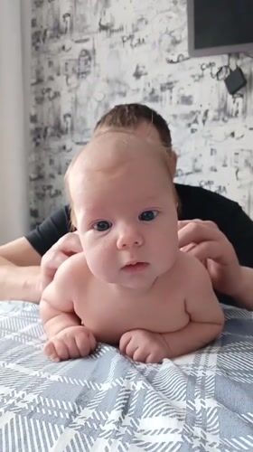 Baby with caregiver observed on bed in Andreyevo