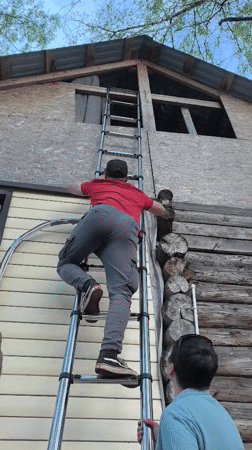 Construction work documented at wooden building in Noviy, Russia