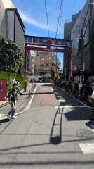 Late-night crowds queue at Shibuya venue near torii gate