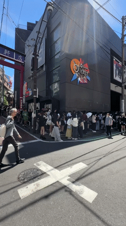 Late-night crowds queue at Shibuya venue near torii gate