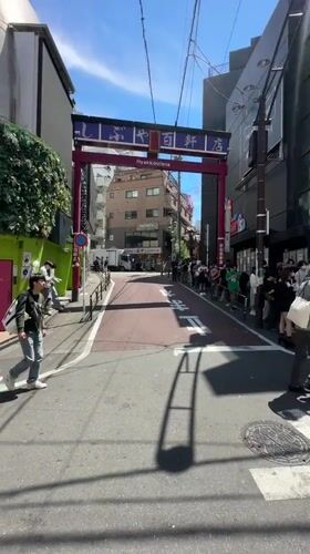 Late-night crowds queue at Shibuya venue near torii gate