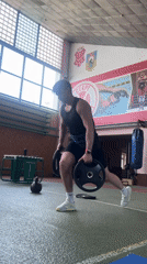 Athlete trains with weights at Poltava sports facility