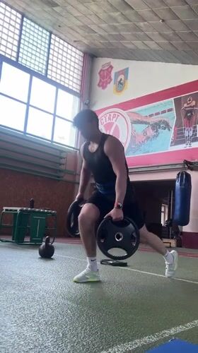 Athlete trains with weights at Poltava sports facility