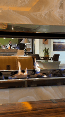 Morning cafe scene documented in Kyiv with fireplace, breakfast