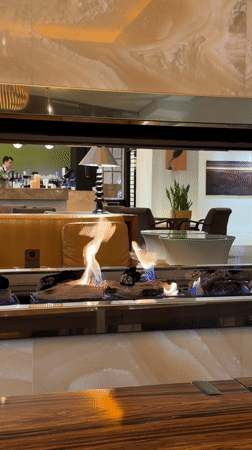 Morning cafe scene documented in Kyiv with fireplace, breakfast