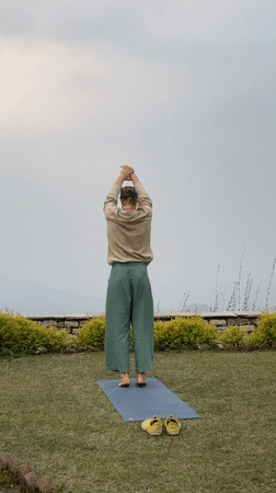 Woman practices yoga, enjoys noodle soup in Dhampus Phedi