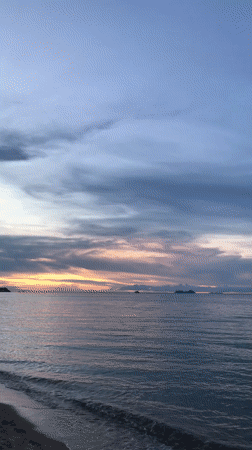 Sunset captured over calm waters near Baan Mae Nam, Thailand