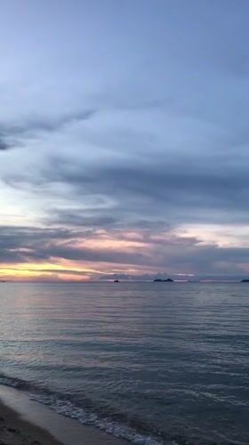 Sunset captured over calm waters near Baan Mae Nam, Thailand