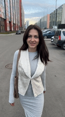 Woman walks to Russian supermarket in evening