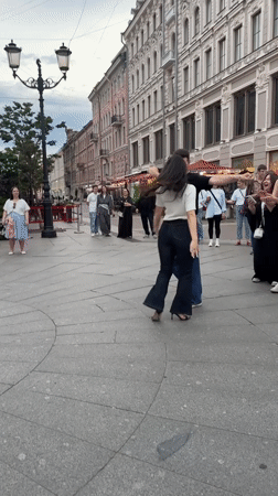 Breakdancers and partners share a Saint Petersburg plaza