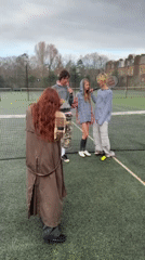 Young people gather for tennis court activity in London