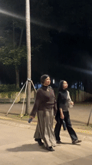 Evening pedestrian activity captured around Jakarta's Monumen Nasional