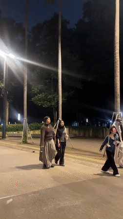 Evening pedestrian activity captured around Jakarta's Monumen Nasional