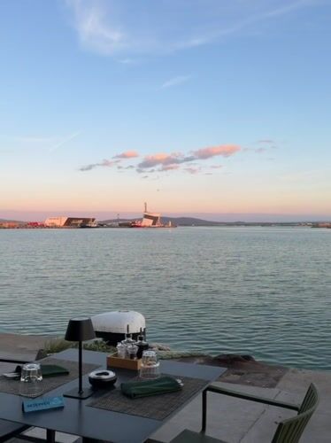 Waterfront dinner in Burgas harbor at dusk