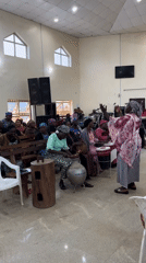 Church service with women's choir and live band in Jos