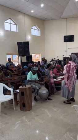 Church service with women's choir and live band in Jos