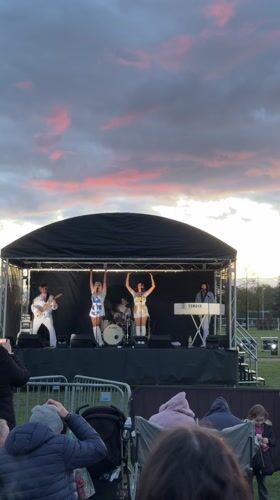 Band performs at South Norfolk fairground during evening hours