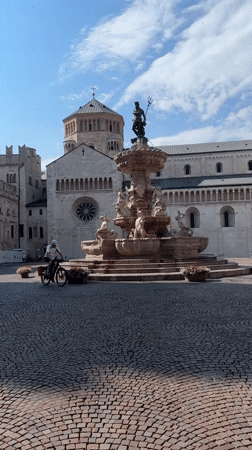 Morning in an Italian town square, ending in a specialty shop