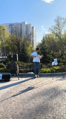 Street violinist performs in sunny Moscow park setting