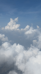 High-altitude cloud formation captured in aerial footage from aircraft