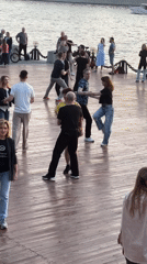 Group performs dance on riverside platform in Moscow