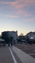 Evening crowd gathers in Blagoevgrad plaza at sunset