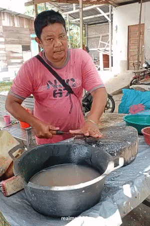 Fresh seafood market operates roadside in Lhokseumawe, Indonesia