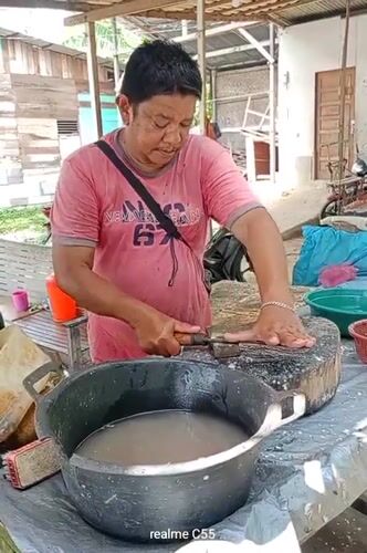 Fresh seafood market operates roadside in Lhokseumawe, Indonesia