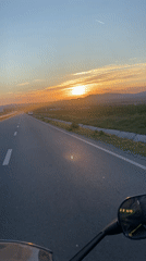 Motorcyclist captures sunset ride on empty Bulgarian highway