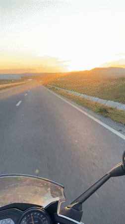 Motorcyclist captures sunset ride on empty Bulgarian highway