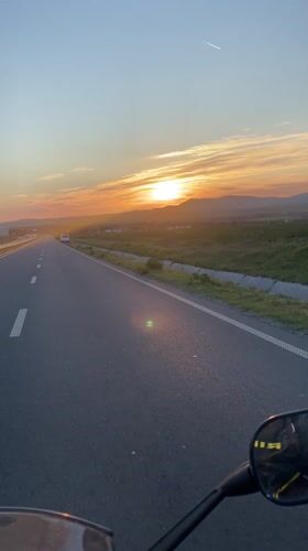 Motorcyclist captures sunset ride on empty Bulgarian highway