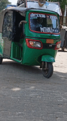 Waste workers collect garbage on Dar es Salaam street