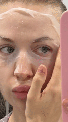 Woman documents skincare routine with sheet mask in Russia