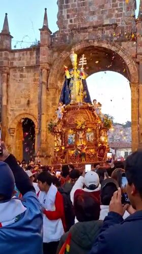 Corpus Christi procession through historic Cusco archways
