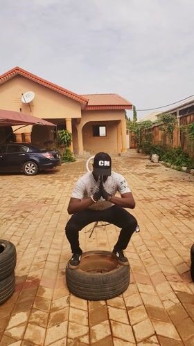 Man exercises with tires, makeshift weights in Nigeria courtyard