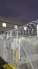 Crowd gathers at fenced Newark industrial facility early morning