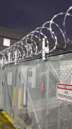 Crowd gathers at fenced Newark industrial facility early morning