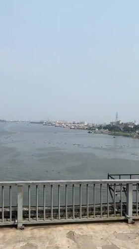 Bridge view captures Dhaka river port activity