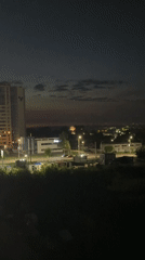 Izhevsk cityscape glows at dusk from a wide urban vantage