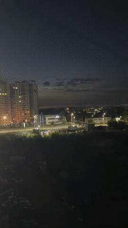 Izhevsk cityscape glows at dusk from a wide urban vantage
