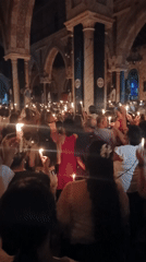 Candlelight gathering fills large church with worshippers
