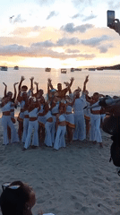 Beach sunset cultural performance with traditional music and dance