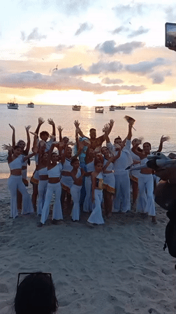 Beach sunset cultural performance with traditional music and dance
