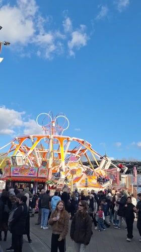 Hamburg amusement park busy with visitors on sunny afternoon