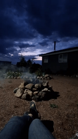 Evening campfire gathering in Kempelevo backyard, June 2026