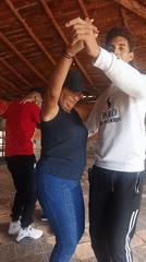 Couples dance at outdoor venue in Juan Griego, Venezuela