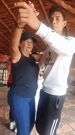 Couples dance at outdoor venue in Juan Griego, Venezuela