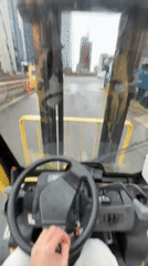 Woman operates forklift in Manchester, documented with #FreakyFriday hashtag