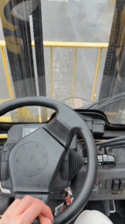 Woman operates forklift in Manchester, documented with #FreakyFriday hashtag
