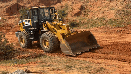 Construction crew operates wheel loader in Bar Gada, Nigeria